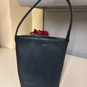 Small Black N/S Park small textured-leather bucket bag tote row